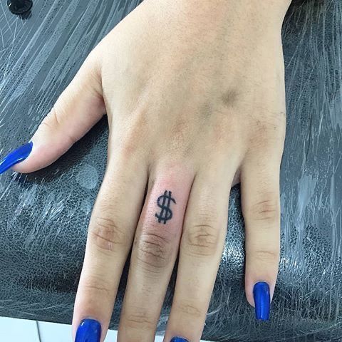 a woman's hand with blue nail polish and a dollar tattoo