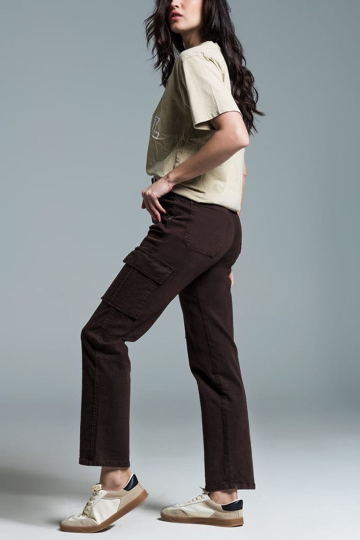 Introducing our Relaxed Cargo Pants in a rich dark brown hue – a versatile and comfortable addition to your wardrobe. These medium-sized cargo jeans come equipped with six pockets, blending style with practicality seamlessly.  The front closure features a zipper and metal button, adding a touch of sophistication to the overall design. With a full length and straight cut, these cargo pants offer a timeless and relaxed look suitable for various occasions.  Crafted for daily wear, these pants are considered a basic essential with their medium sizing, making them perfect for a range of body types. The belt loops provide the option for accessorizing, while the stretch denim ensures both style and flexibility.  The side and back pockets, along with the zip fastening, enhance the functionality of Brown Cargo Pants, Types Of Jeans, Denim Pocket, Knitwear Tops, Cargo Jeans, Wholesale Clothing, Online Womens Clothing, Fashion Store, Cargo Pants