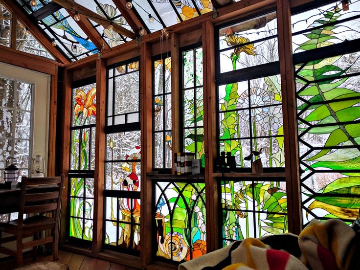 the inside of a house with stained glass windows