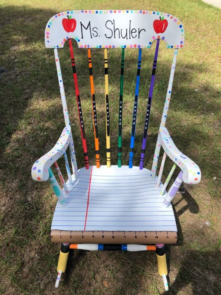 a chair made out of crayon sticks with the name ms shuler on it