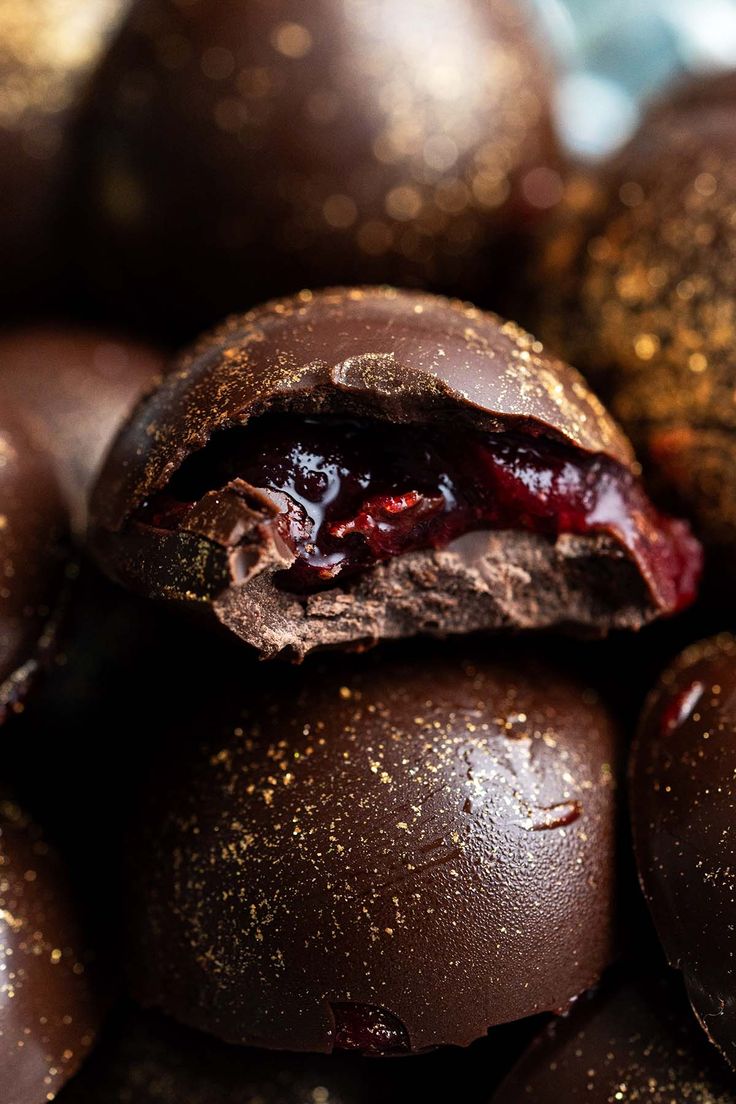 a pile of chocolate covered donuts sitting on top of each other