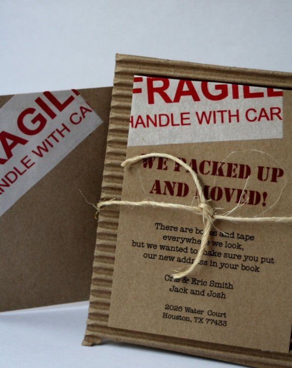 two brown bags tied up with twine and string on top of each other next to an envelope that says fragile handle with care