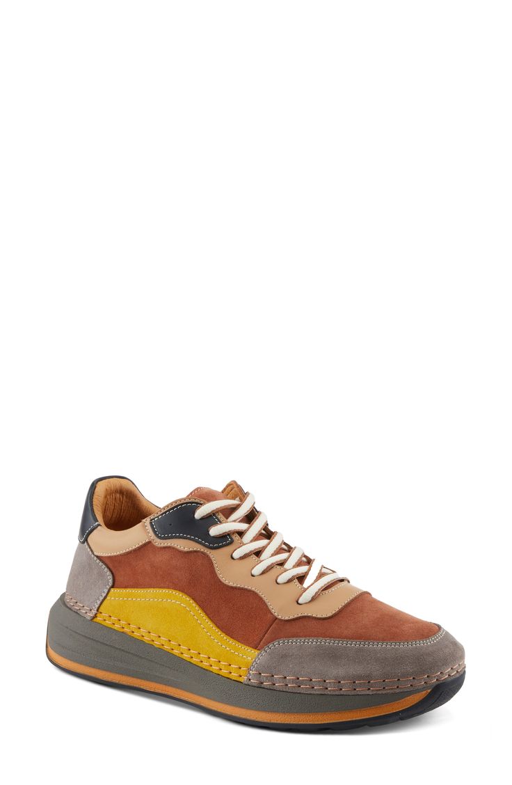 This sporty sneaker is topped with colorblocked leather and grounded on an exaggerated sole. 1 1/2" heel; 1" platform Lace-up style Removable, cushioned insole with arch support Leather upper and lining/synthetic sole Made in Turkey Multicolor Platform Sneakers With Contrast Sole For Streetwear, Sporty High-top Suede Chunky Sneakers, Sporty Multicolor High-top Sneakers With Contrast Sole, Multicolor Leather Sneakers For Streetwear, Modern Multicolor Round Toe Sneakers, Multicolor High-top Platform Sneakers With Contrast Sole, Low-top Suede Sneakers With Lug Sole, Multicolor Low-top Chunky Sneakers With Contrast Sole, Modern Yellow Sneakers With Vibram Sole