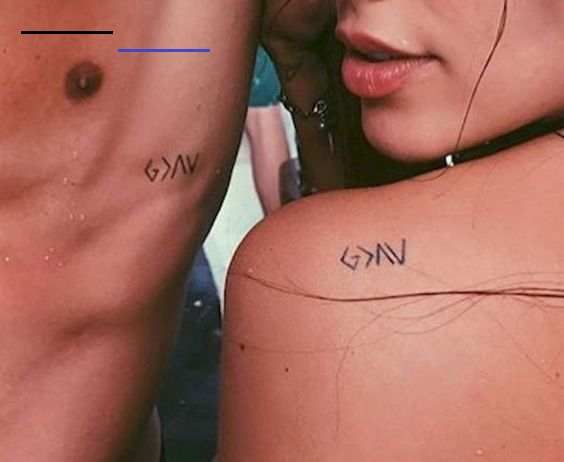 two people with small tattoos on their backs