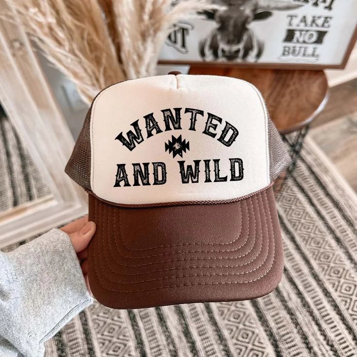 Unleash your inner cowgirl with the Wanted & Wild Foam Trucker Hat! This stylish and adorable hat brings a western vibe to your outfit while keeping you cool and comfortable. Whether you're out in the sun or dressing up for a night out, this hat will add a cute touch to any look. 100% Polyester Front 100% Polyester Mesh Back Matching Color Braid 8 Rows Stitching Plastic Adjustable Snap Matching Color Sweatband One Size Fits Most Western Adjustable Trucker Hat With Curved Brim, Western Style Adjustable Trucker Hat With Curved Brim, Trendy Baseball Cap For Country Events, Trendy Cap For Western-themed Events, Western Style Adjustable Trucker Hat For Ranch, Adjustable Western Trucker Hat For Ranch, Western Style Adjustable Trucker Hat, Western Snapback Trucker Hat For Ranch, Western Trucker Hat With Curved Brim For Country Events