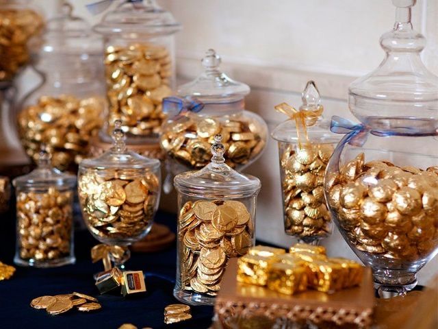 there are many glass jars filled with gold coins