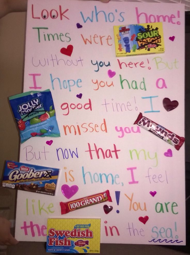 a sign with candy on it that says i love you and other things in the background