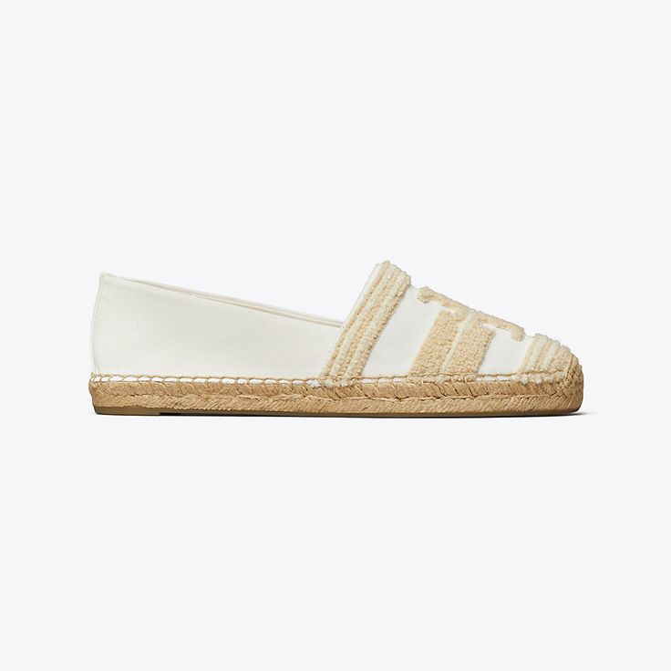 Mixed materials add texture and subtle dimension to the warm-weather essential. Crafted in canvas with woven terry and set on a jute sole, the Double T espadrille is a versatile and effortless style. White Textile Espadrilles For Beach, White Textile Espadrilles For The Beach, Casual Straw Espadrilles With Woven Sole, White Textile Espadrilles For Vacation, White Straw Espadrilles Casual Style, White Straw Casual Espadrilles, Casual White Straw Espadrilles, White Espadrilles With Textured Footbed For Spring, Casual Straw Espadrilles With Textured Footbed