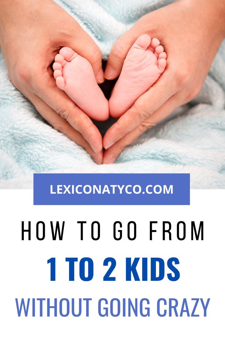 someone holding their baby's feet in the air with text overlay that reads how to go from 1 to 2 kids without going crazy