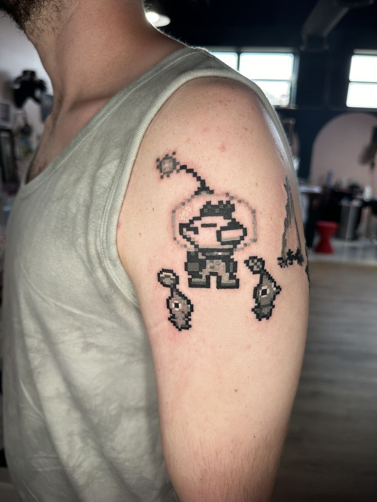 a man with a pixel tattoo on his arm