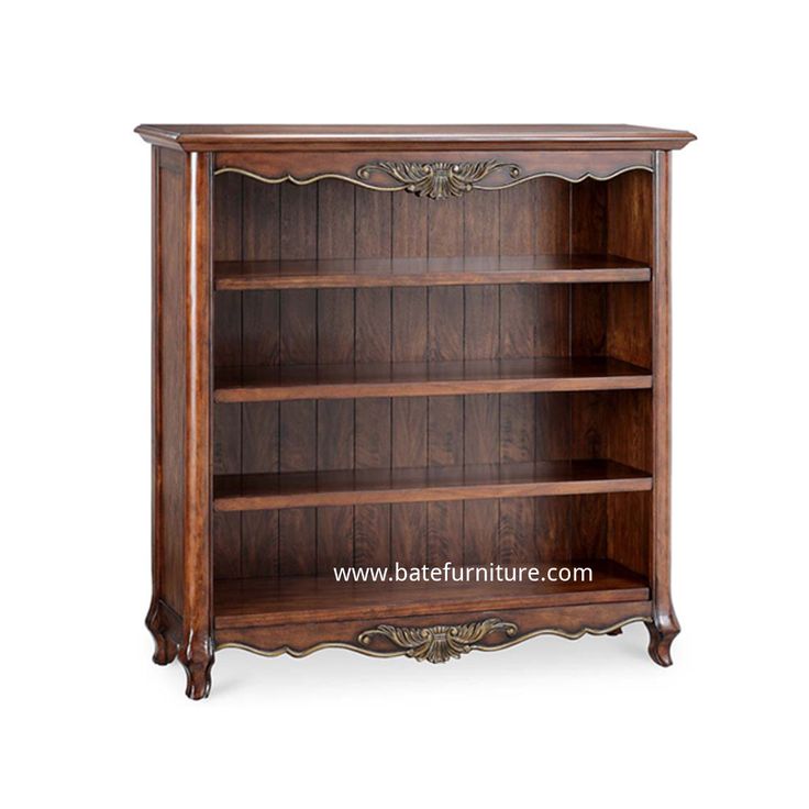 an antique wooden bookcase with ornate carvings on the front and sides, in dark wood