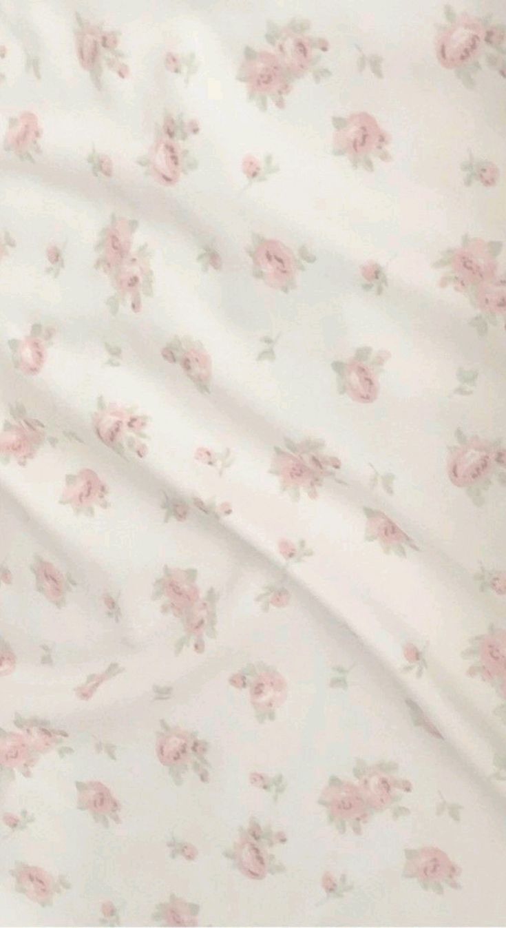 a white sheet with pink flowers on it