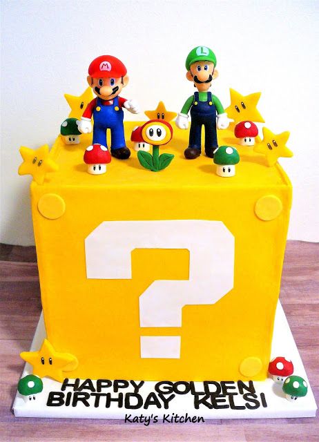 a birthday cake that looks like mario and luigi are on top of a block with an question mark