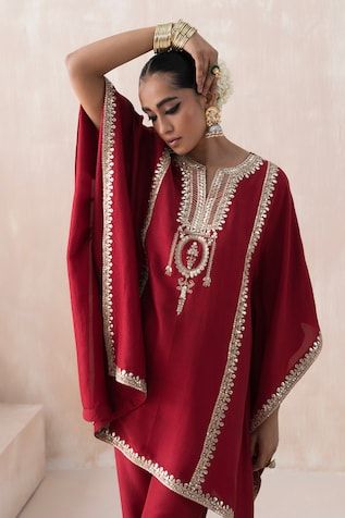 Maroon kaftan with gota embroidered vine motifs, embellished by sequins. Comes with pant. - Aza Fashions Festive Chanderi Kaftan With Mirror Work, Unstitched Kaftan With Mirror Work For Navratri, Traditional Embellished Chanderi Kaftan, Festival Chanderi Kaftan With Mirror Work, Chanderi Kaftan With Mirror Work For Festivals, Chanderi Kaftan With Resham Embroidery For Wedding, Georgette Kaftan With Resham Embroidery, Silk Kaftan With Mirror Work, Designer Dabka Work Straight Kurta Kaftan