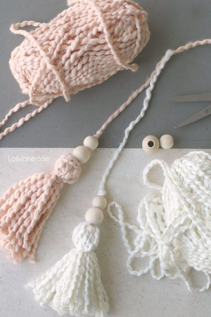 crochet tassels and yarn are laid out on the table