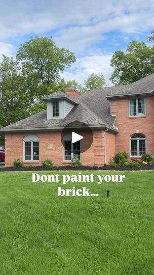 a large brick house with the words don't paint your brick in front of it