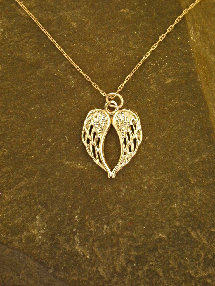 This Angel Wings pendant is 14K Gold. The included chain is a 14K Gold chain. You may chose 16, 18 or 20 inch at the same price. Other length available at sightly higher prices. This Angel Wings pendant measures 13/16" tall by 5/8" across. I hand cast all my pieces using the lost wax casting method. Please ask your needs. You may call me with questions, often I am out so please use my machine. 831-476-3176. You may also call using your credit card directly with me. Satisfaction Guaranteed! I sen Wing-shaped White Gold Necklace For Gift, Silver Heart Pendant Necklace In 14k Gold, 14k Gold Silver Heart Pendant Necklace, Gold Wing-shaped Sterling Silver Necklace, Hallmarked White Gold Necklace For Memorial, Rose Gold Sterling Silver Necklace, Sterling Silver Rose Gold Memorial Jewelry, Yellow Gold Wing-shaped Necklace For Gift, Fine Jewelry Sterling Silver Charm Necklace Stamped 14k