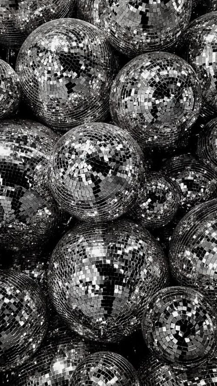 black and white photograph of disco balls