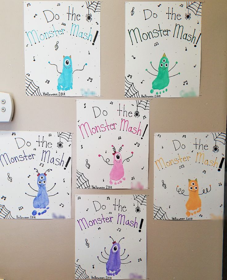 the magnets on the refrigerator are decorated with monsters and do the monster mash