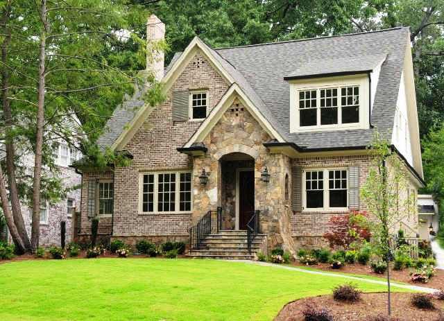 a large brick house with lots of windows