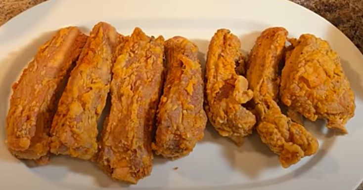 fried chicken strips on a plate ready to be eaten