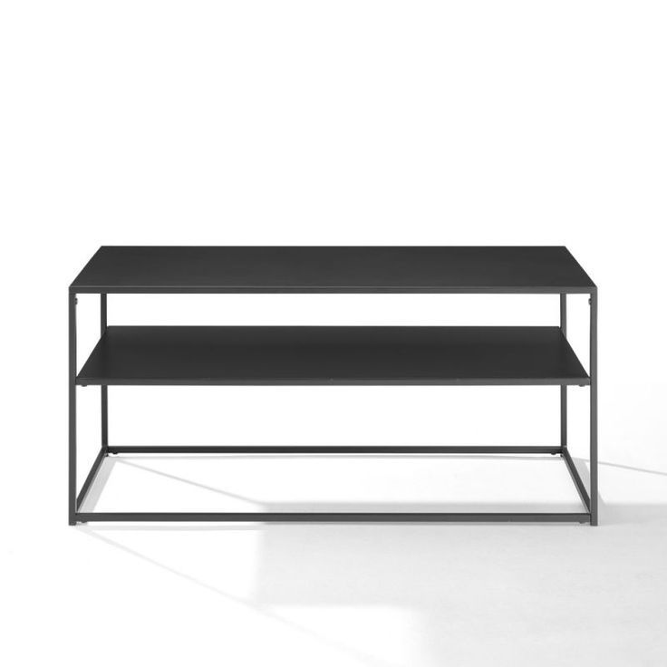 a black table sitting on top of a white floor