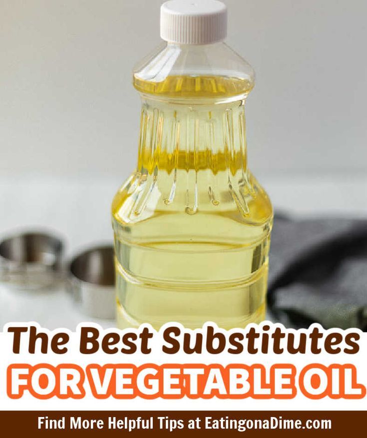 a bottle of vegetable oil sitting on top of a table