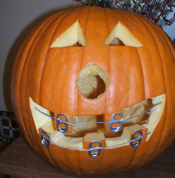 a carved pumpkin sitting on top of a table