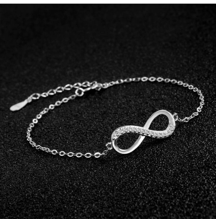 ♥ MATERIAL: 925 sterling silver and cubic zirconia. 925 Sterling Silver is the ideal metal material for making accessories thanks to its proven shine, brightness and strength. ♥ size: bracelet length: 15cm + 4cm (extension), infinity size: 2*1cm, weight: 1.8g. ♥ Infinity Design: Infinity symbol silver bracelet, simple and elegant design. Infinity means infinite love and friendship forever. It is an ideal gift for your good friend, lover or yourself. ♥ Packaging: Packed in a filigree gift box, it Elegant Silver Chain Bracelet With Sparkling Stones, Diamond Bracelets With Silver Chain For Gift, Silver Adjustable Chain Bracelet For Anniversary, Elegant Sterling Silver Crystal Bracelet As Gift, Minimalist Silver Infinity Bracelet, Sterling Silver Cubic Zirconia Bracelet For Anniversary, Sterling Silver Bracelet With Sparkling Stones In Diamond White, Elegant Diamond Bracelet With Silver Chain In White Gold, Silver Crystal Chain Bracelet With Sparkling Stones