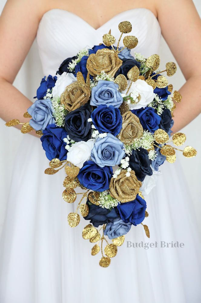 Ink blue, navy blue, royal blue and gold glitter roses with babies breath wedding flower brides bouquet with roses and peonies Blue And Gold Floral Arrangement, Blue And Gold Wedding Bouquet, Royal Blue And Gold Bouquet, Navy Blue And Gold Bouquet, Blue White And Gold Bouquet, Blue And Gold Flower Arrangements, Royal Blue And Gold Wedding, Blue And Gold Wedding Theme, Blue And Gold Wedding