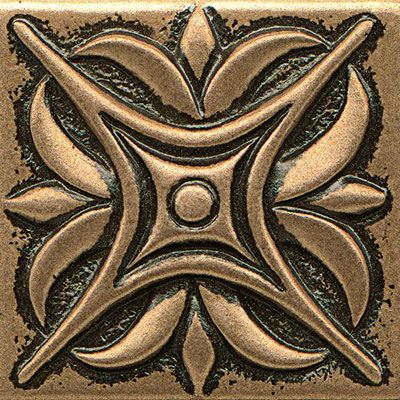 a square tile with an intricate design on it