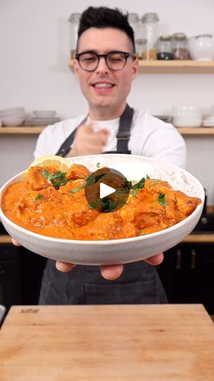 a man holding a bowl filled with food