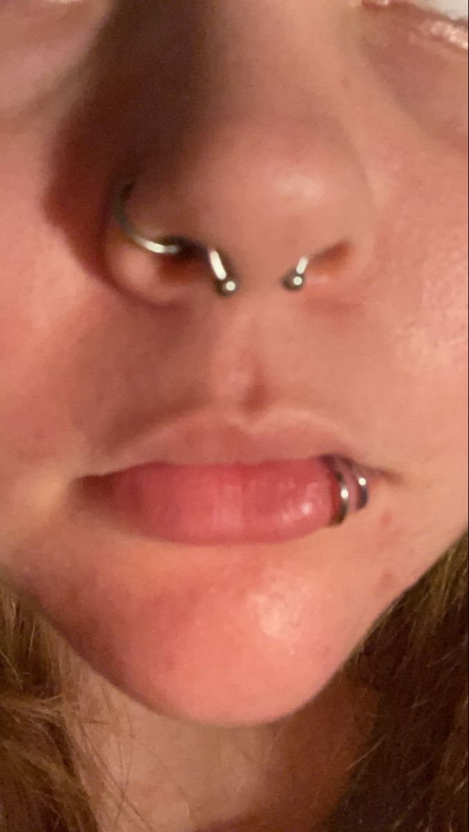 Its a nose, lip and septum piercing Septum And Piercing Nose, Septum And Lip Piercing Together, Spider Bite Lip Piercing, Septum With Nose Ring, Nose Piercing Stud And Septum, Mouth Piercings Lips, Septum Piercing With Nose Ring, Septum And Lip Piercing, Septum And Nose Ring