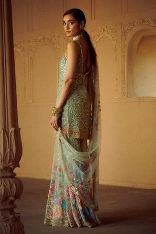 Mint green kurta with floral embroidered motifs. Paired with embroidered sharara and dupatta. 
Components: 3
Fabric: Net
Neckline: V neck
Sleeve Length: Sleeveless
Color: Green
Embroidered
Tiered sharara
Sheer dupatta
Floral motif work - Aza Fashions Green Dupatta With Intricate Embroidery In Chinon, Green Sharara With Intricate Embroidery For Reception, Bollywood Style Pista Green Palazzo Set With Floral Embroidery, Green Chinon Salwar Kameez With Intricate Embroidery, Green Sharara With Resham Embroidery In Traditional Drape, Green Palazzo Set With Intricate Embroidery For Reception, Green Embroidered Palazzo Set For Reception, Festive Pista Green Palazzo Set With Floral Embroidery, Green Chinon Dupatta With Intricate Embroidery