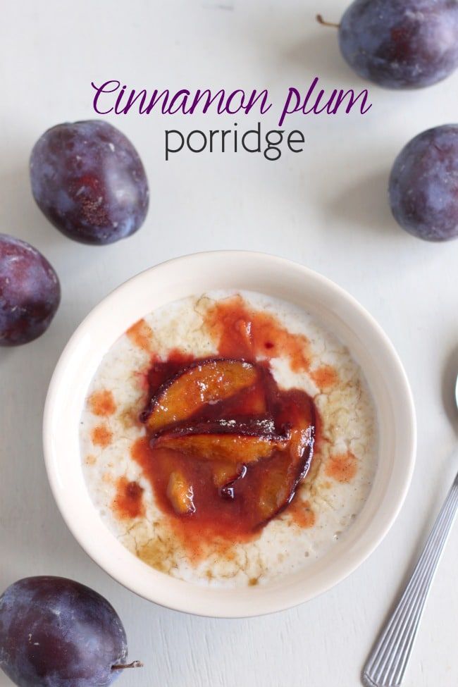 a bowl filled with oatmeal and plums