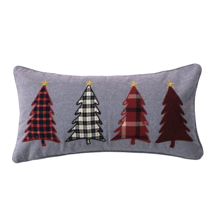 three christmas trees on a gray pillow