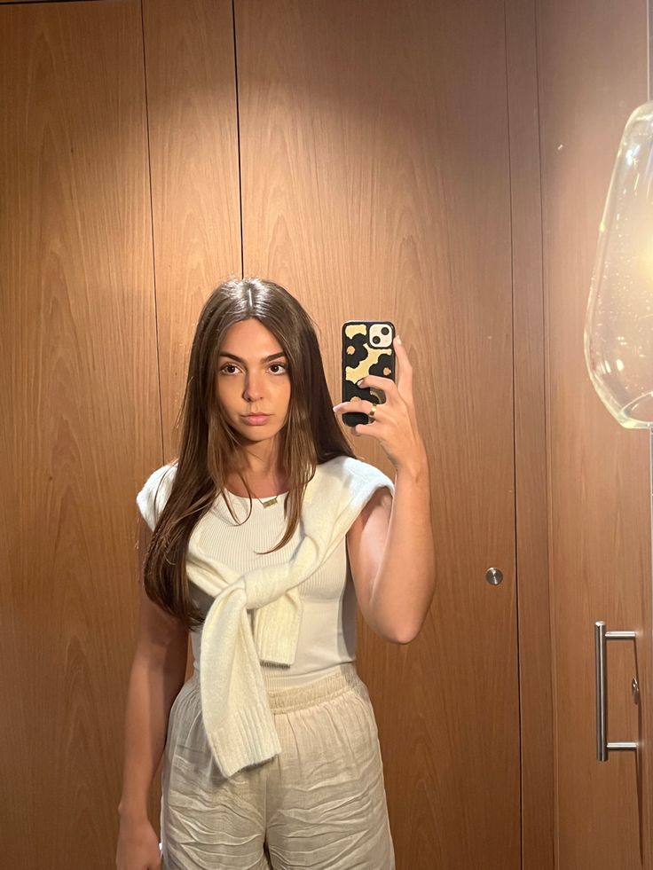 Linen Pants And Sweater Outfit, Sweater Tied Around Shoulders, Sweater Tied Around Shoulders Outfit, Embroidered Phone Case, Phone Case Mirror, Long Hair Brown, Brunette Long Hair, Funky Flowers, Neutral Outfits