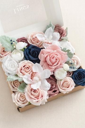 a box filled with flowers on top of a table