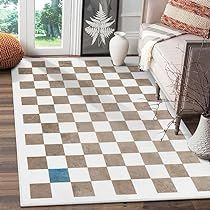 a large checkered rug is in the middle of a room