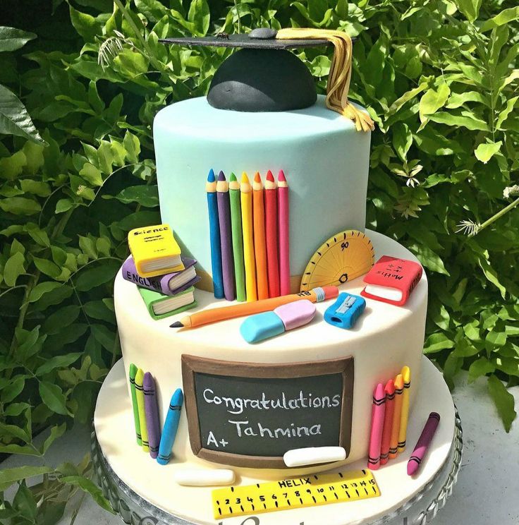 there is a cake with school supplies on it