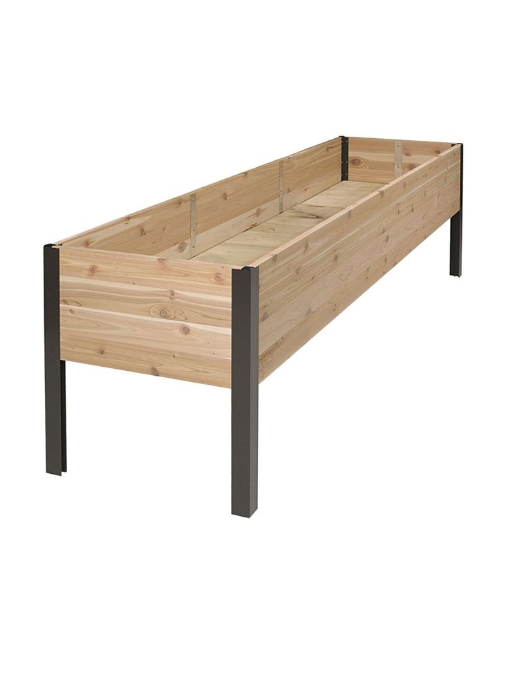 a wooden bed frame with metal legs