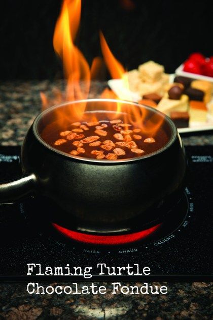 a pot filled with soup sitting on top of a stove next to a plate of food