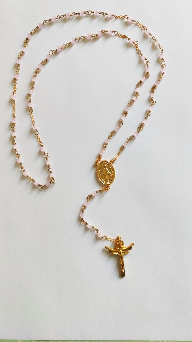 Unlike conventional rosaries, ours are designed with a special technique that ensures durability and longevity with the thread folded to prevent any accidental breakage, offering peace of mind during your moments of prayer and reflection. Each rosary is meticulously crafted with a touch of reverence, using carefully selected materials that reflect both beauty and durability. Our signature piece features exquisite pink agate, chosen for its unique elegance and timeless appeal. As you hold one of Pink Rosary, Pink Agate, Prayer Cards, Rosary, Bead Charms, Halloween Shopping, Beauty Book, Agate, Charms