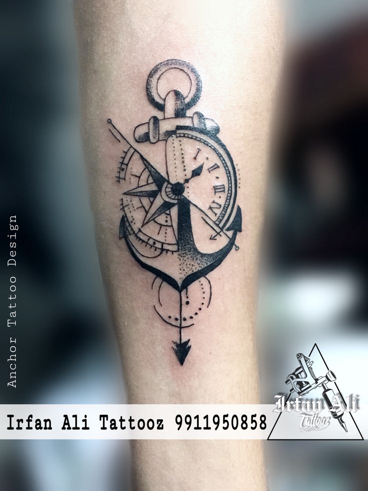 a black and white tattoo with an anchor, compass and clock on the arm that reads italian tattoo parlor 911909588