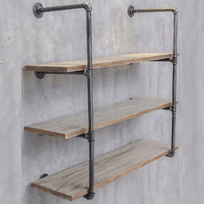 the industrial pipe shelves are made from wood and metal pipes, with one shelf on each side