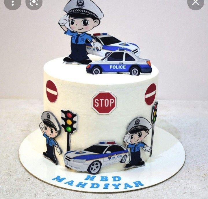 a birthday cake with police figures on it