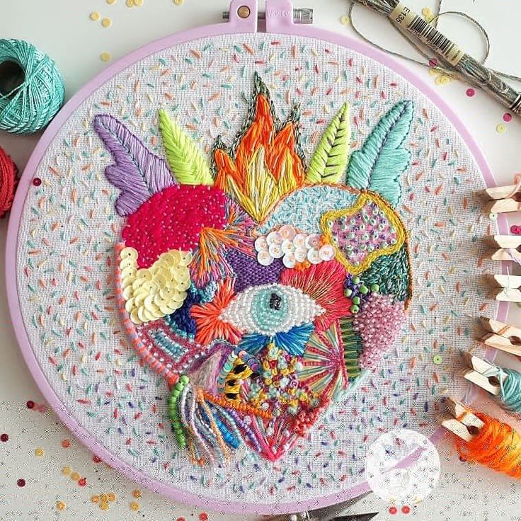 an embroidery project is being displayed on a table