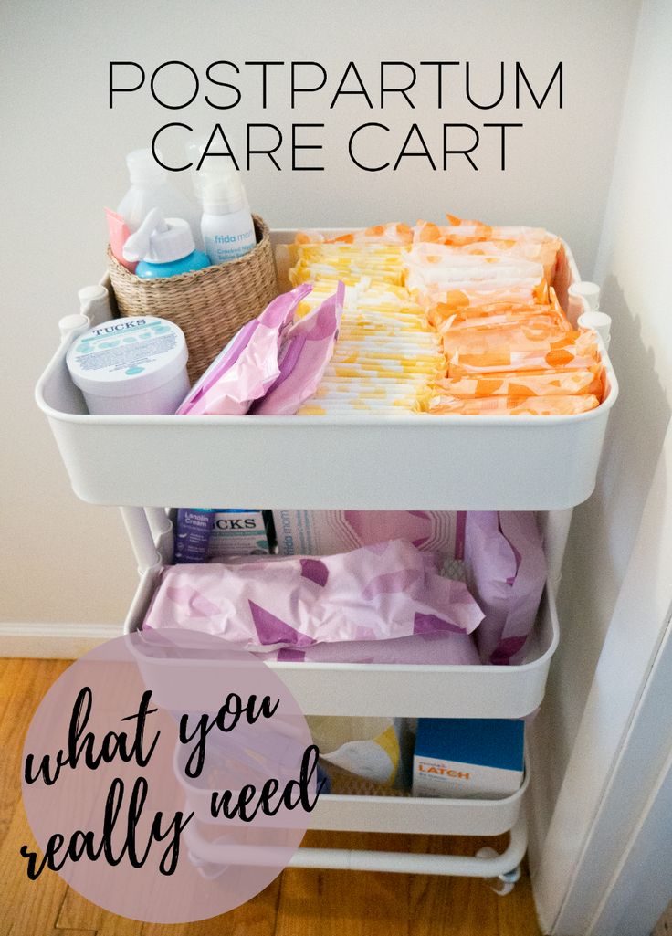 a white cart filled with lots of items on top of a wooden floor