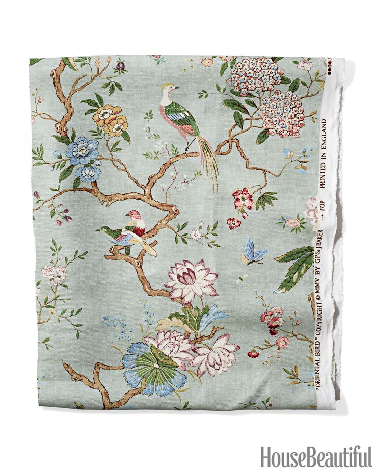 a blue and white floral print scarf with birds on it