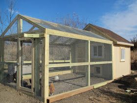 a chicken coop in the middle of a yard